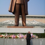 putting down flowers in front of Kim Il Songs monument 1