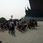 putting down flowers in front of Kim Il Songs monument 2